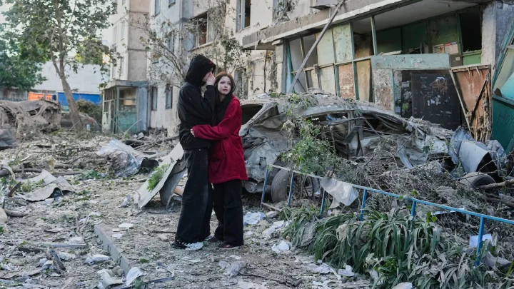 Russian attack on Ukraine kills at least 11 and traps others in damaged buildings